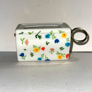Vintage floral stamp dispenser. Made in Japan.